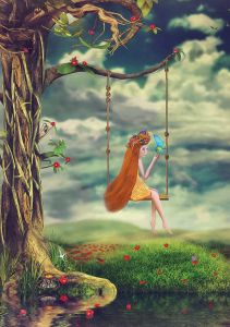 Young girl on a swing in the forest